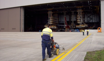 2 Pack Epoxy Being Sprayed On Hangar Apron