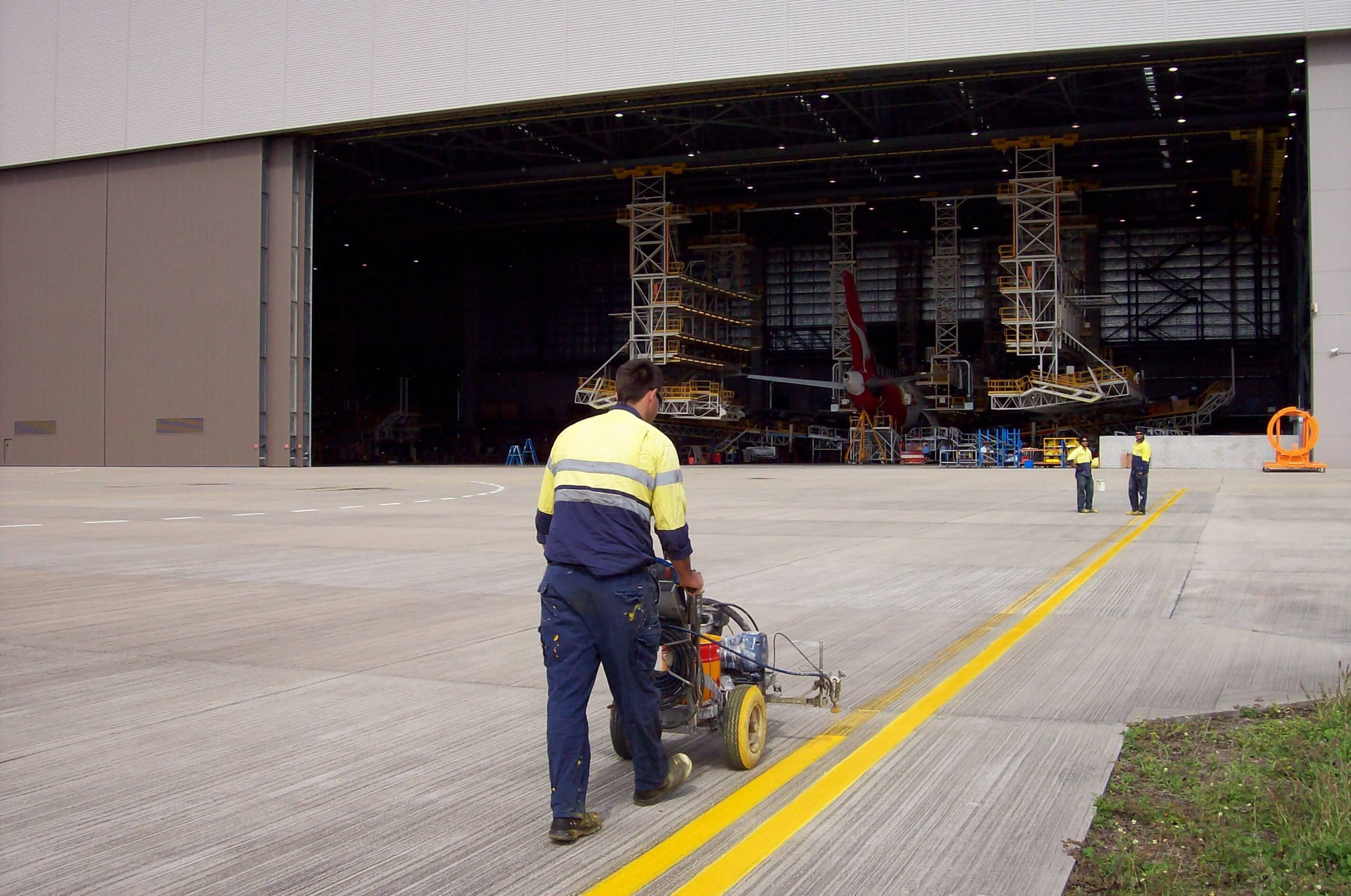 2 Pack Epoxy Being Sprayed On Hangar Apron