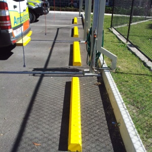 Car Park Wheel Stops Painted Yellow For Clear Visibility