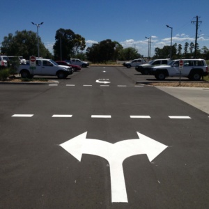 Give Way Line And Double Heade Arrow In Car Park