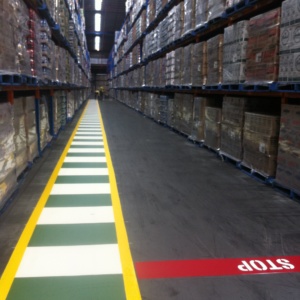 Solid Green Walkway With Pedestrian Crossing In Distribution Warehouse