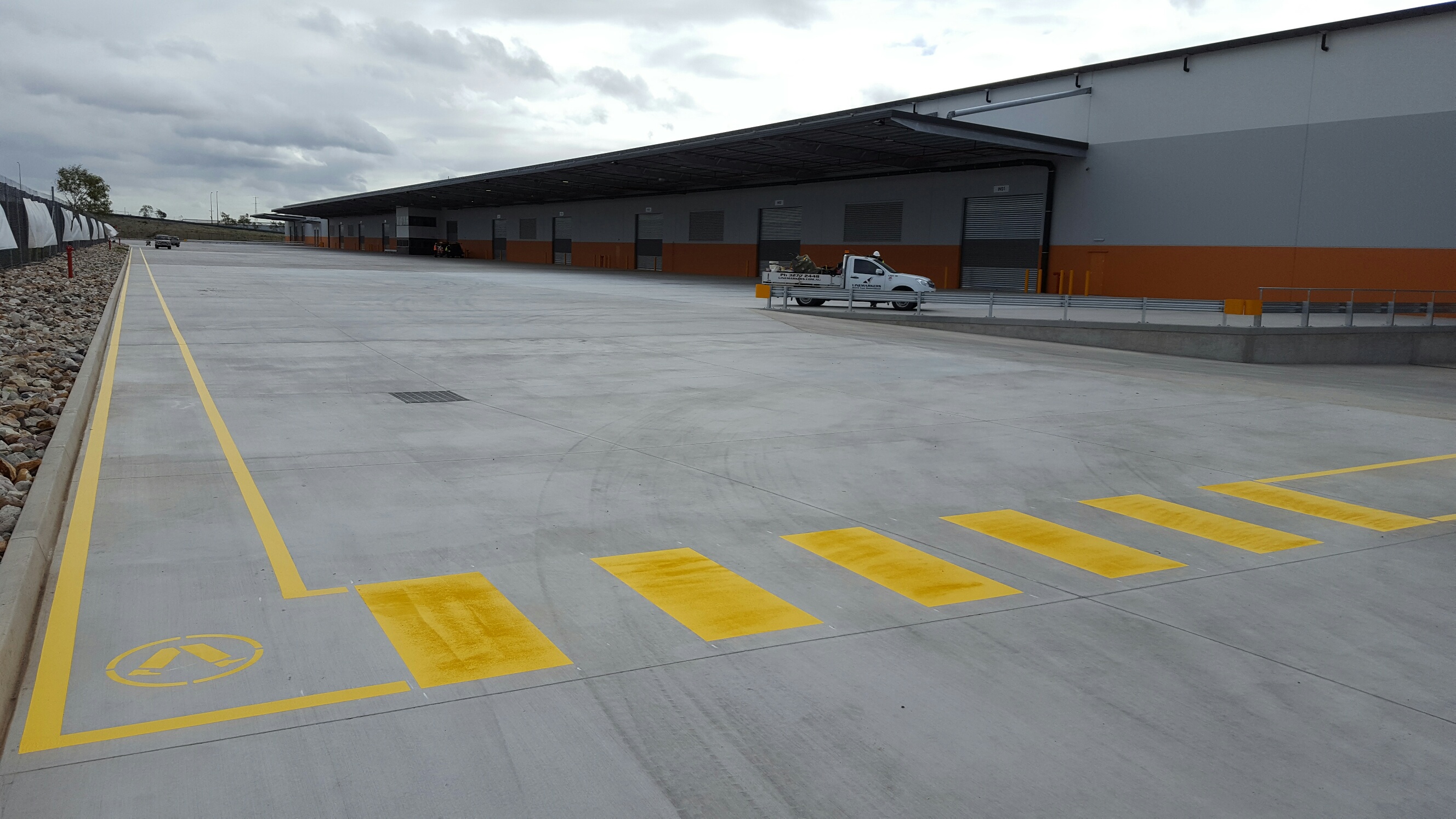 Warehouse With Long Walkway And Pedestrian Crossing Line Marking